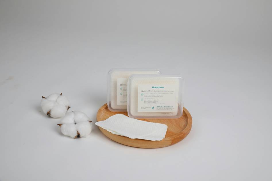 Flat lay of nail care essentials including remover, oils, and tools